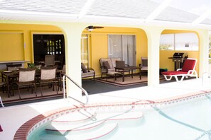 A wide spacious lanai for outdoor living opens to the whole house & canal views.