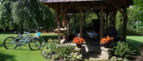 Outdoor dining with BBQ and fireplace.