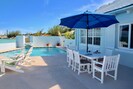 Patio and pool beside the sea