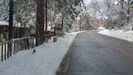 Road in front of cabin with snow