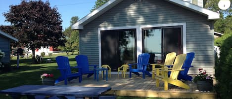 Relax on the deck with a view of the lake.