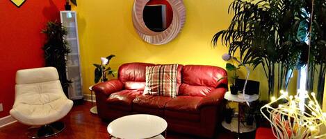  Living room with sleeper sofa, sleeps too, laminate floors, recessed lighting, 50 inch flatscreen TV. Sitting chair 