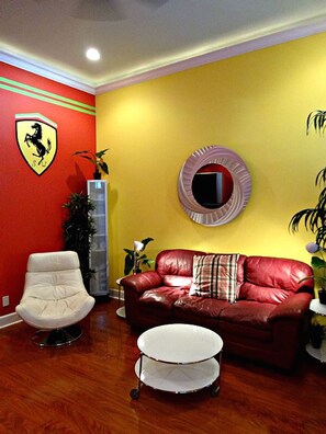 Living room w/ sleeper sofa, sleeps 2,  75" flat screen Smart TV, sitting chair