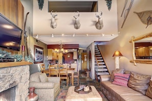 Full view of kitchen, living area and stairs