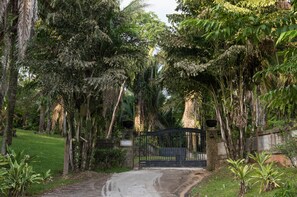 Entry gates to privately walled house and garden