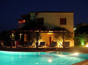Pool and villa by night