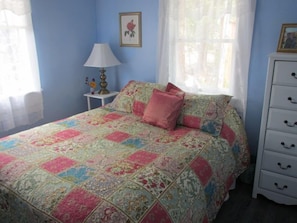 Queen size bed in the sunny and bright 'master' bedroom