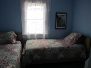 Two twin beds in the 'kids room'.