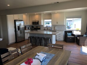 Well stocked kitchen with brand new cabinets and appliances! 