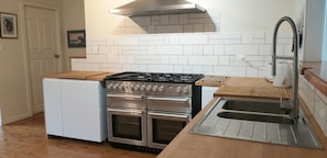 New kitchen, gas cooker with side by side electric ovens