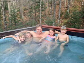 A large hot tub that can accommodate 6-8 adults (kids not included).