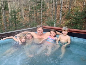 A large hot tub that can accommodate 6-8 adults (kids not included).