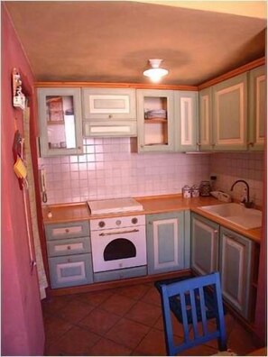 Kitchenette with oven and dish washer.