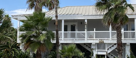 Key West style house has two private upstairs vacation units. 