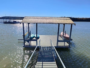 Dock with paddleboards and kayaks