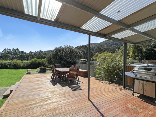 Back deck delight: BBQ, scenic backdrop. Outdoor dining and lasting memories await.