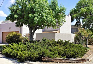 Private corner two story townhome with two car garage steps from Old Town.