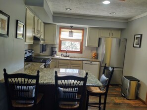PLENTY OF DISHES, POTS, PANS, SLOW COOKER, ICE CREAM MAKER BLENDER, AND MORE. 