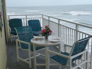 Seating on balcony w/table to enjoy dining