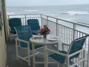 Seating on balcony w/table to enjoy dining