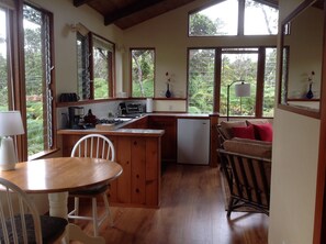 Beautiful retreat cottage surrounded by greenery.