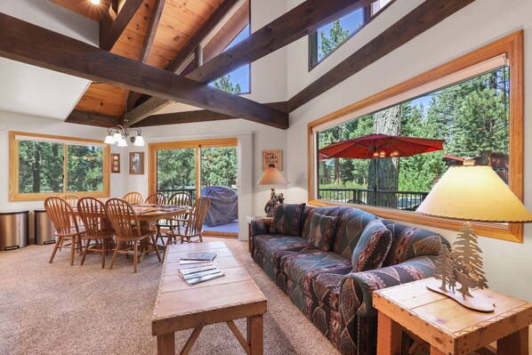 Bask in the natural light of this inviting living area with views of the pines.