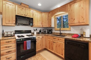 Let the tranquil views of nature inspire your cooking in this beautiful kitchen.