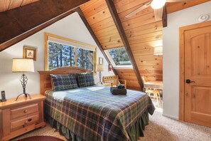 Room with a view, queen bed and panoramic windows bring Tahoe beauty inside. 