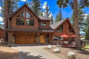Your summer haven awaits with a picturesque cabin surrounded by lofty
pines.