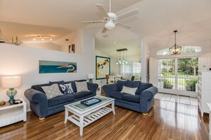 Living room, dining room, and front door view.