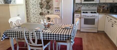 Full kitchen stocked with small and large appliances.