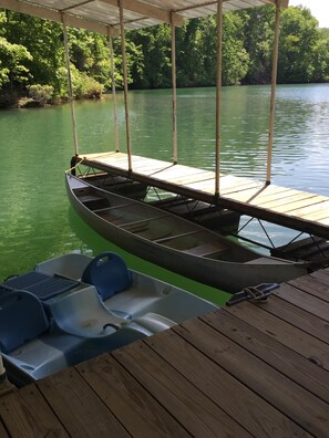 Paddle boat and canoe provided for exploring the cove