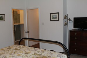 Bedroom with entrance to closet and bathroom