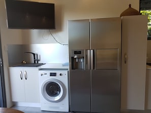 laundrette and fridge with icemaker