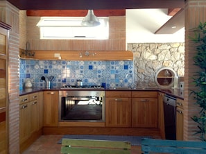 large kitchen fully equipped, decorated with Vietri majolica