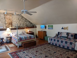 Upstairs sleeping area with queen bed and twin-size daybed.