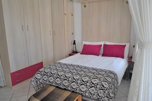 Bed and wardrobe area
