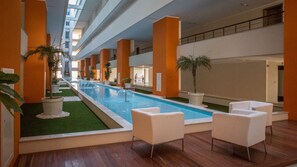 Atrium with 2 panoramic elevators, stylishly decorated with plants and fountains