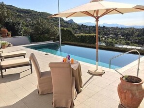 dining at the pool with panoramic sea view
