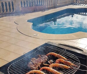 BBQ in the sun beside the pool