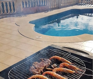 BBQ in the sun beside the pool