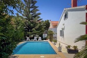 Swimming pool by the side of the house