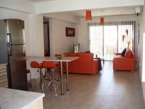 Looking out over living area to balcony