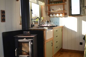 Log burner and kitchen