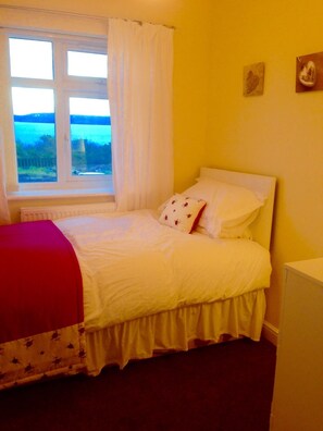 Single Bedroom with sea view - with additional pull up guest bed available.