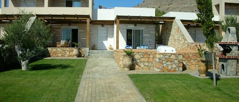 Front Garden and patio and pool area   