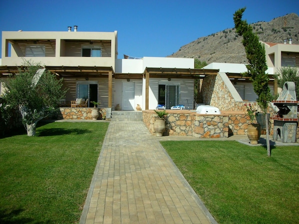 Front Garden and patio and pool area   