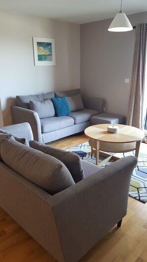 Living room area  straight out onto the balcony with views to the ocean.