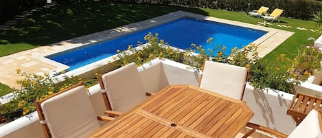 Balcony Ground floor, swimming pool and garden view