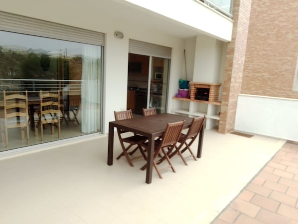 Spacious terrace with private built in BBQ and large dining area